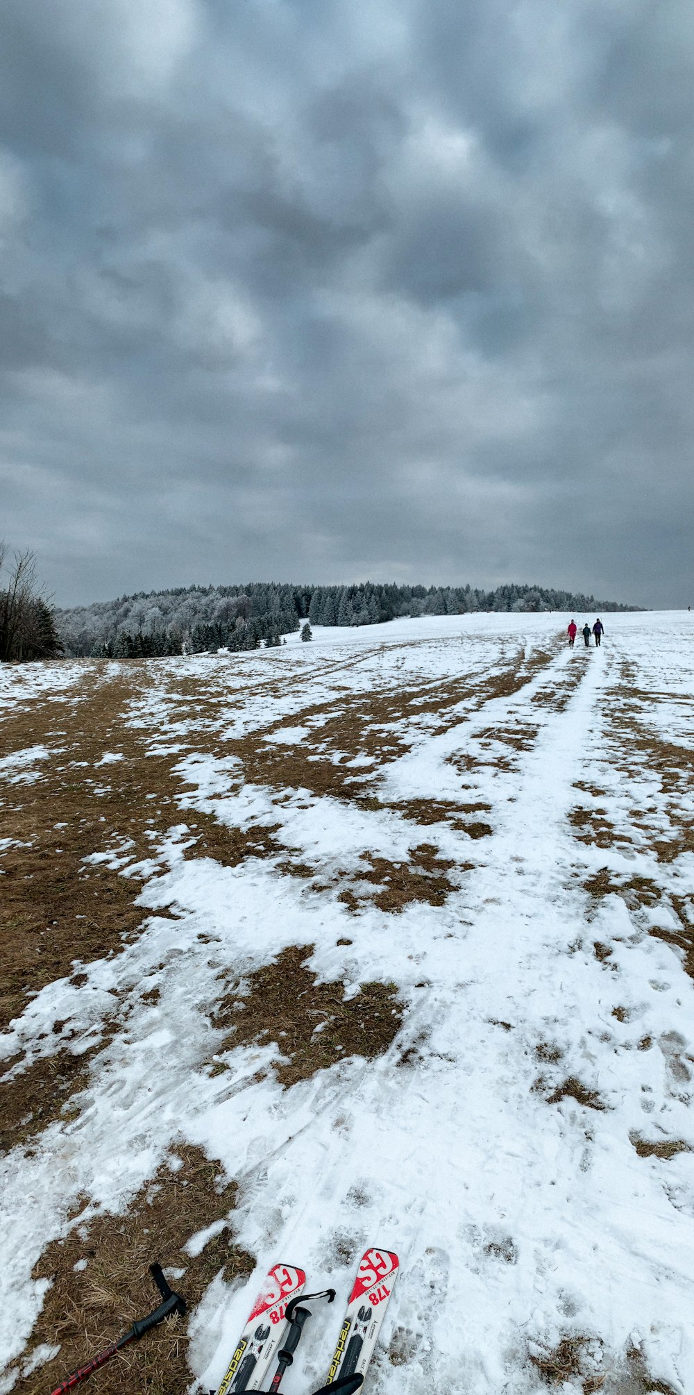 a pair of skis on a snowy hill