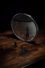 a black and white photo of a chess board and a black and white chessboard