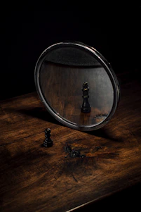 a black and white photo of a chess board and a black and white chessboard