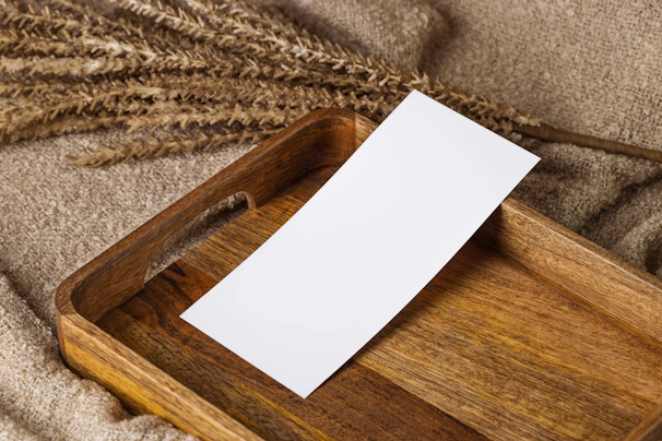Elegant wooden tray with subtle grain patterns, styled on a neutral-toned table.