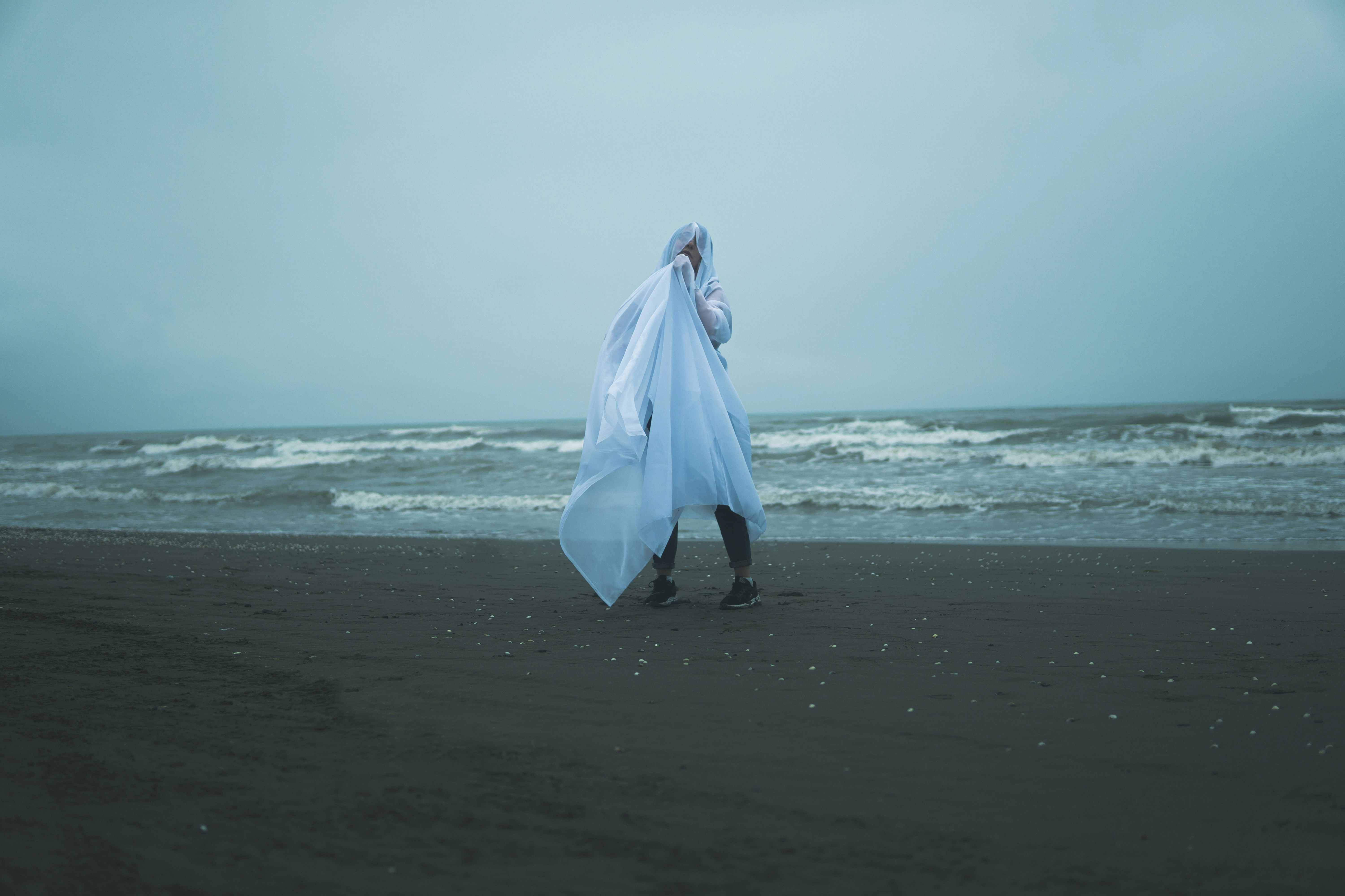 Beach portrait with white sheet