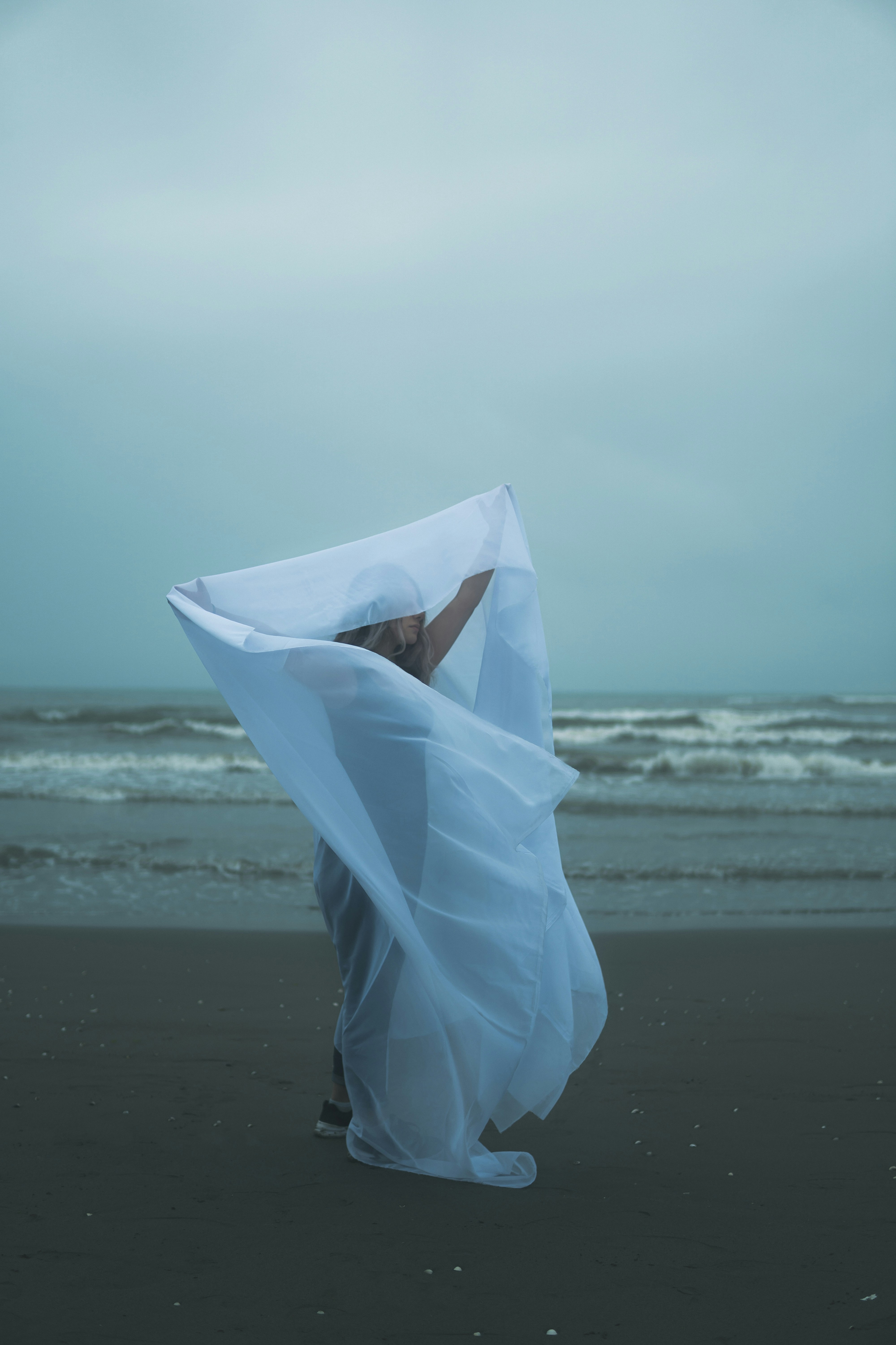 A white umbrella on a beach