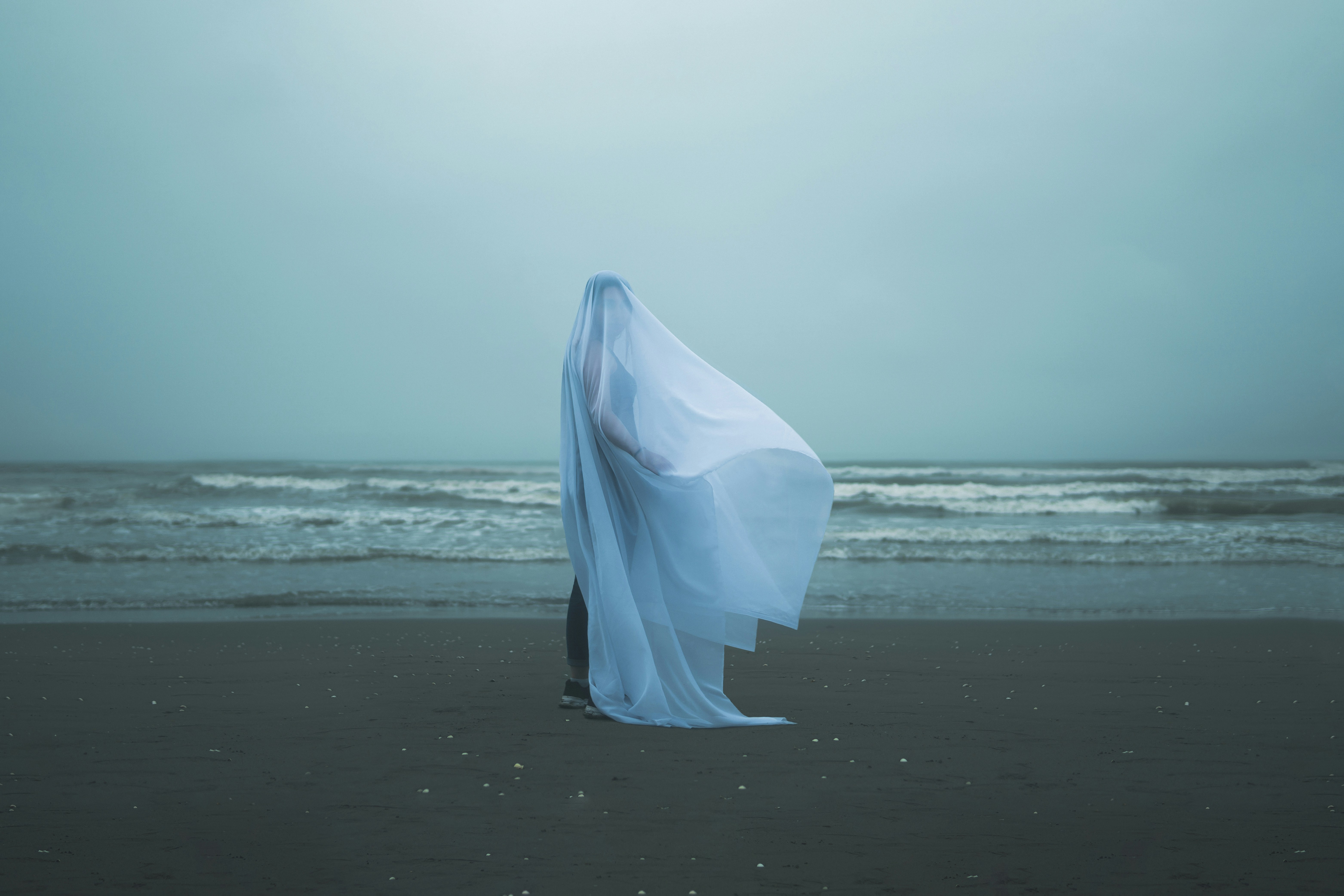 A white umbrella on a beach