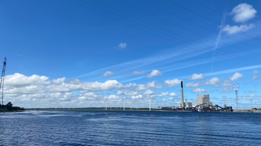 a body of water with power lines above it