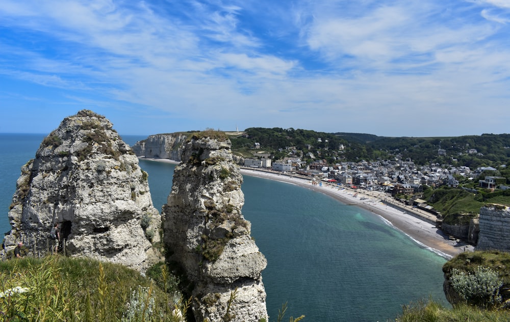 a cliff with a body of water below