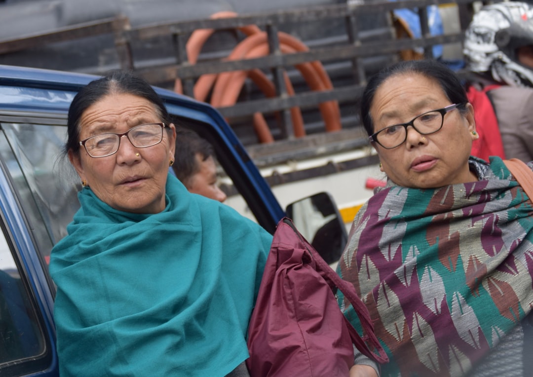 A split image showing Mamata Banerjee and Abhishek Banerjee on one side, and a few BJP leaders including Suvendu Adhikari on the other, symbolizing the political divide.