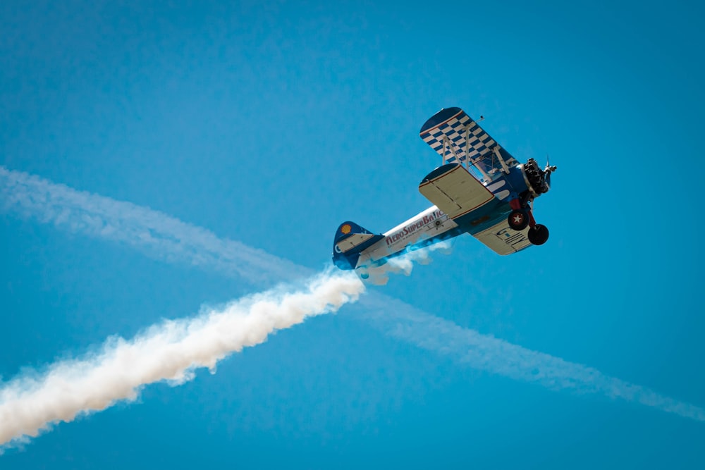 a small airplane flying through the air