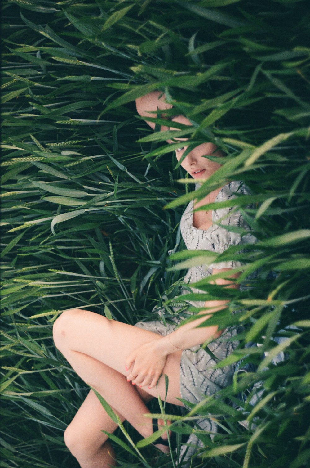 a woman in a dress in a tree