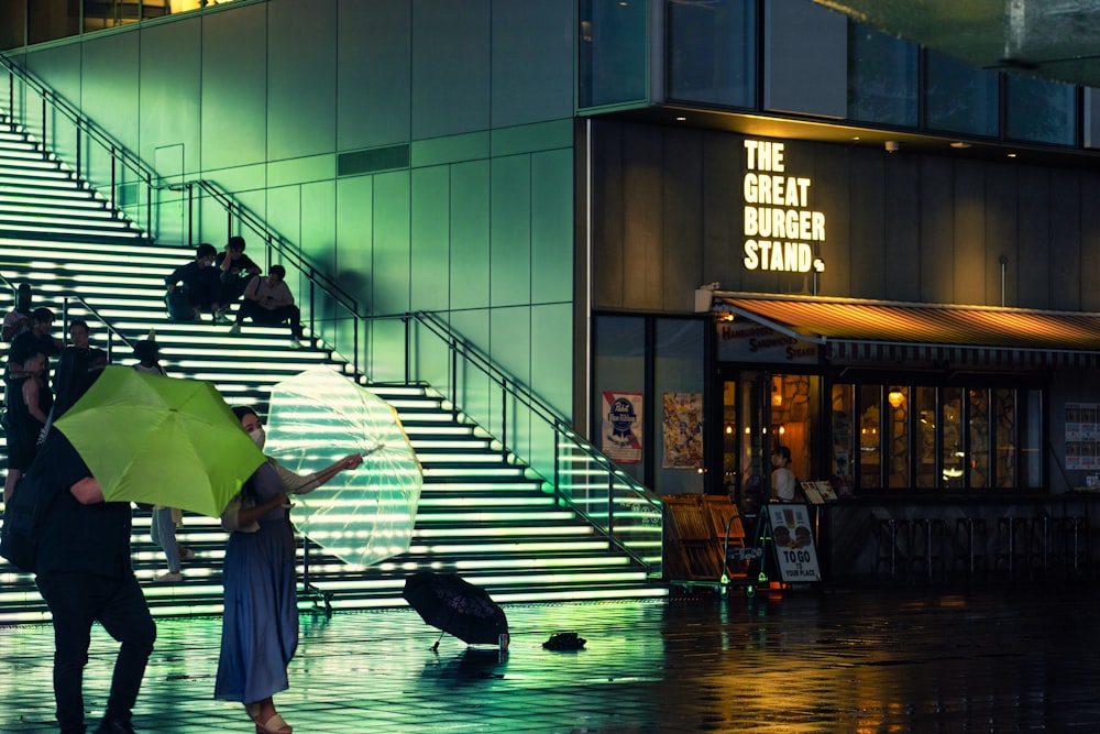 a woman walking in the rain holding an umbrella