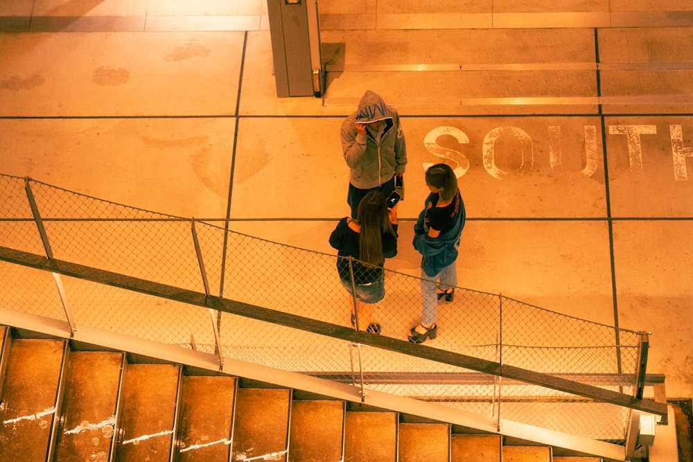 a couple of people playing basketball