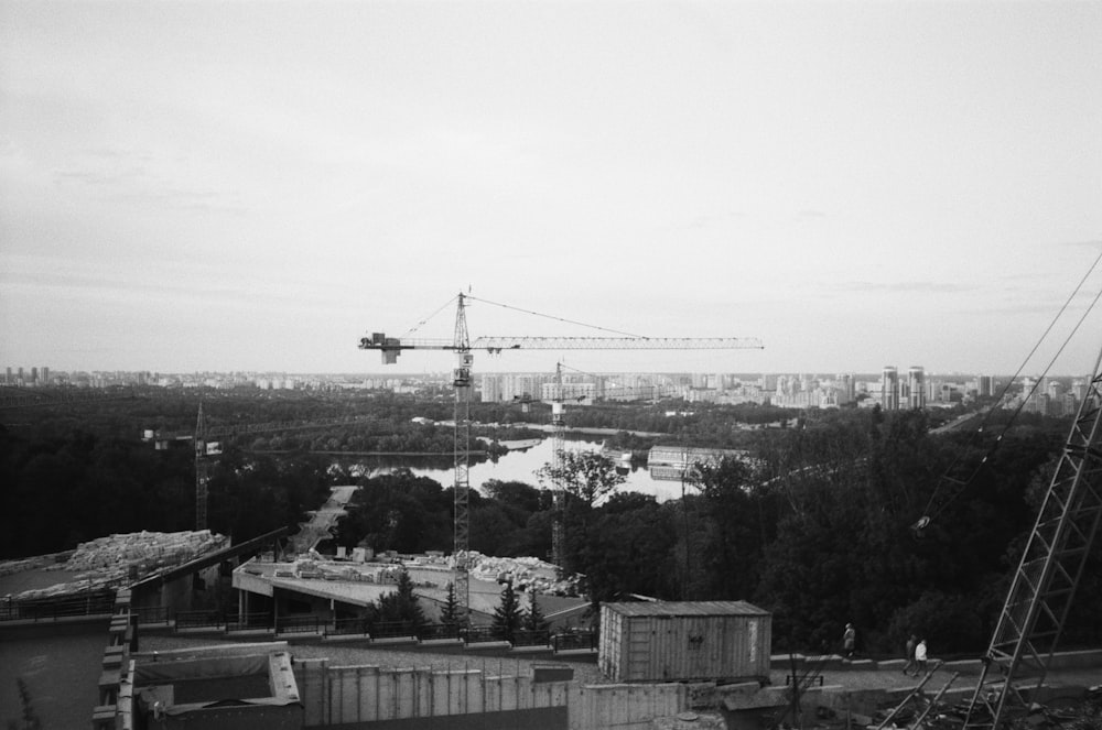 a construction site with cranes