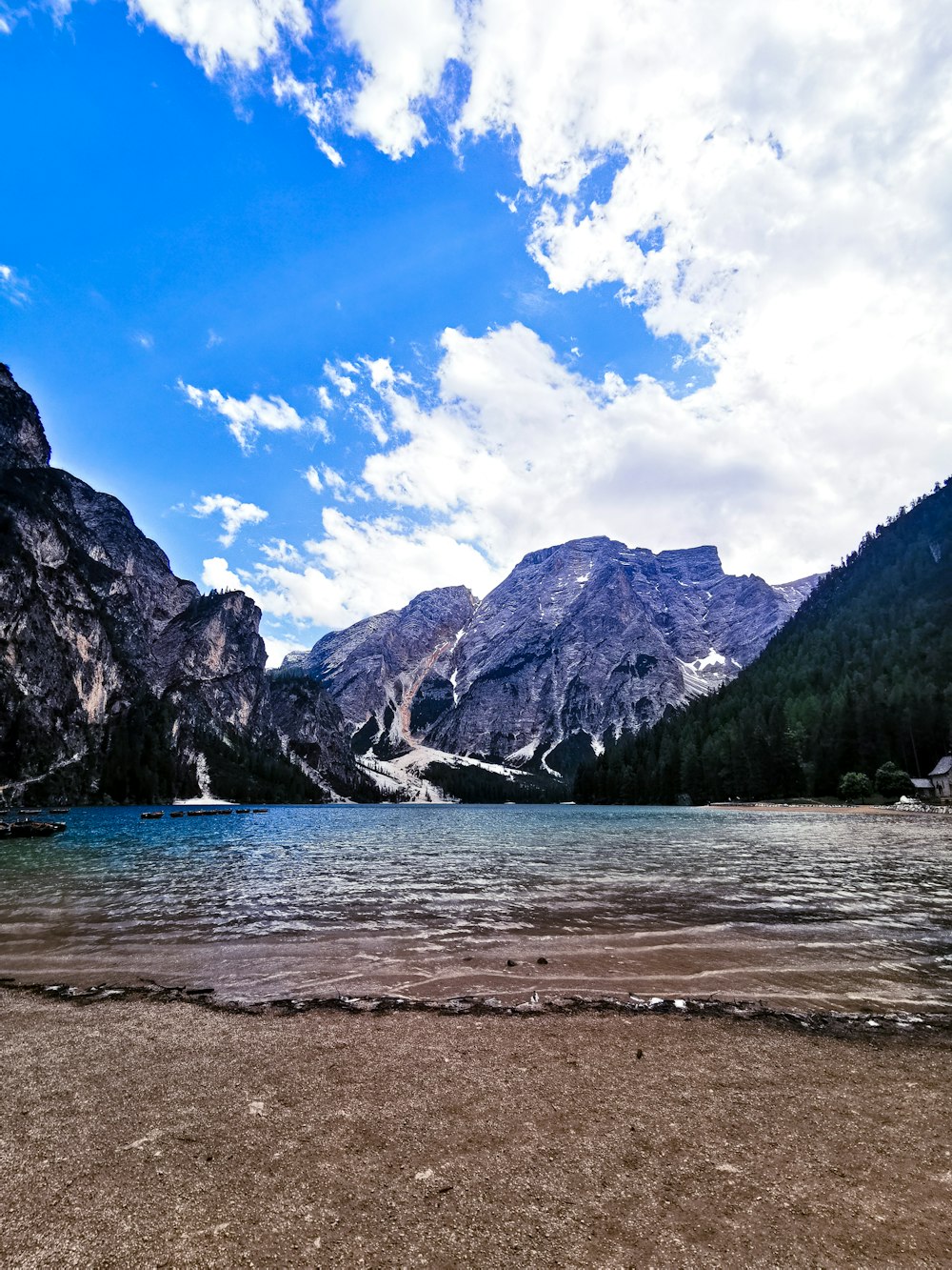 a body of water with mountains in the back