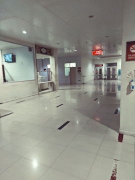 A tidy hallway with freshly cleaned walls and floors, well-lit.