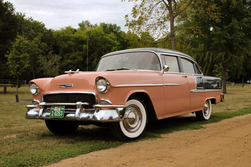 an old car parked on grass