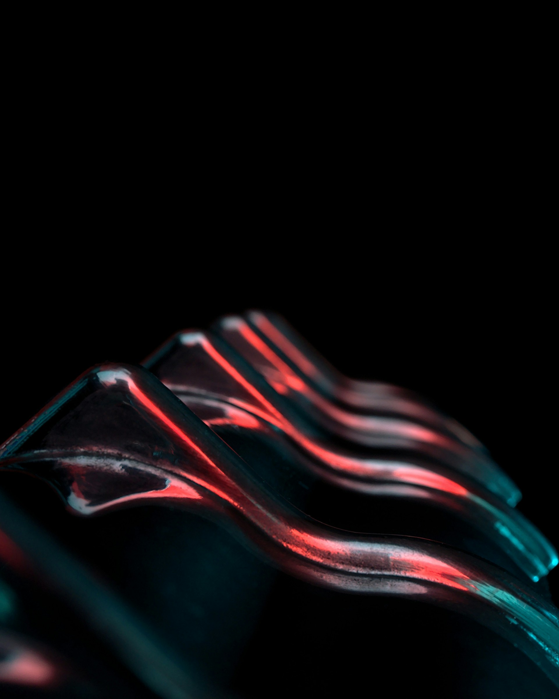 Close-up of a futuristic sculpture surface with glowing circuits and smooth curves, highlighting craftsmanship.