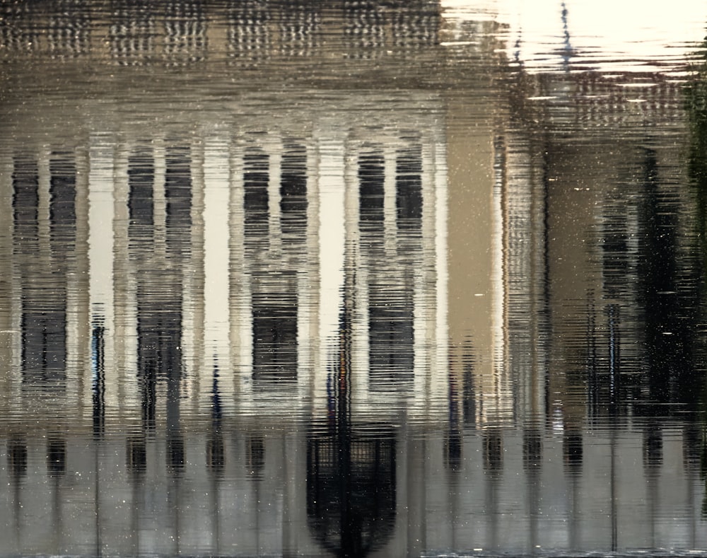 a reflection of a building in water