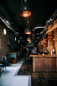 a restaurant with a bar and chairs