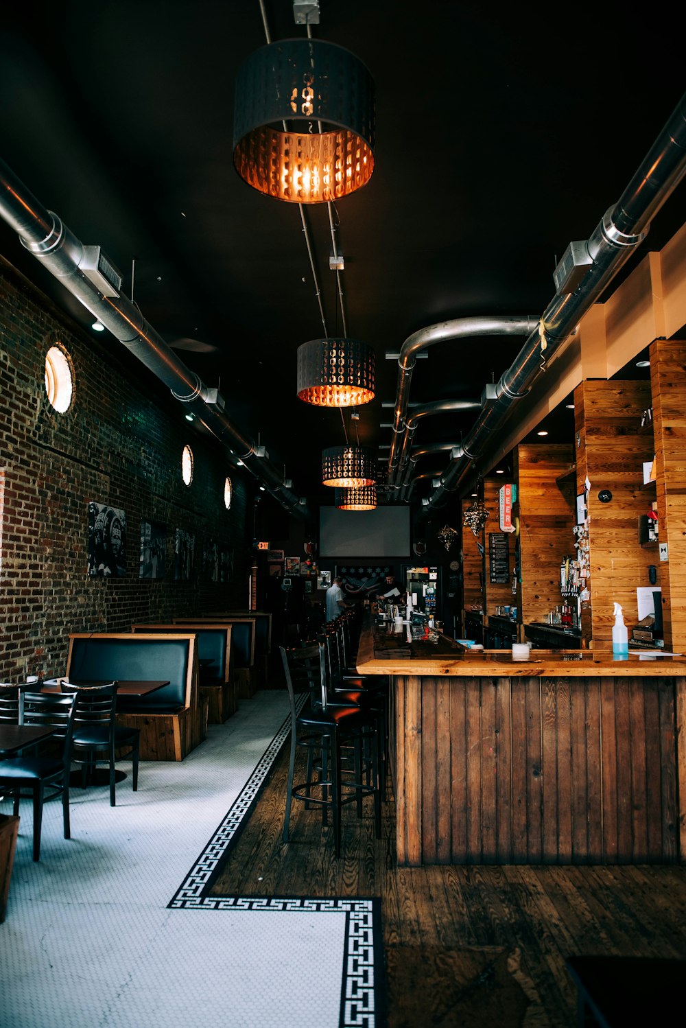 a restaurant with a bar and chairs