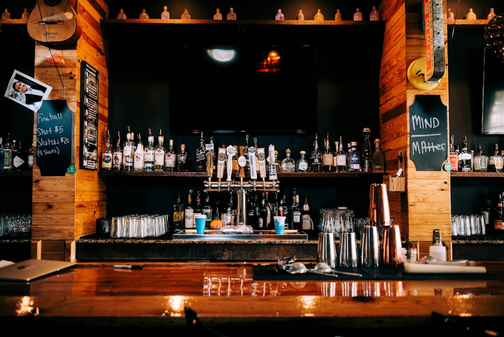 a bar with many bottles of alcohol