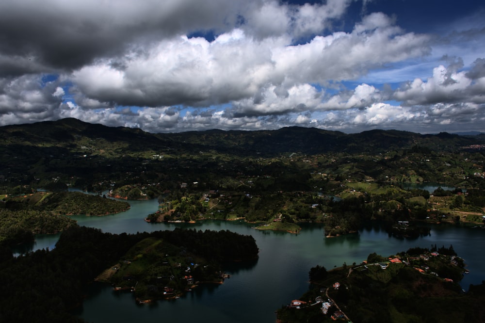 a river with islands and mountains in the background