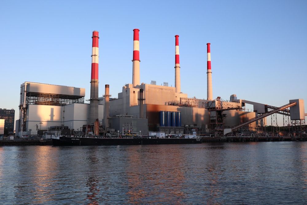 a factory with smoke stacks