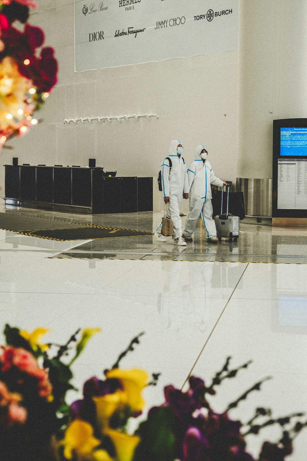 a couple of people in white suits