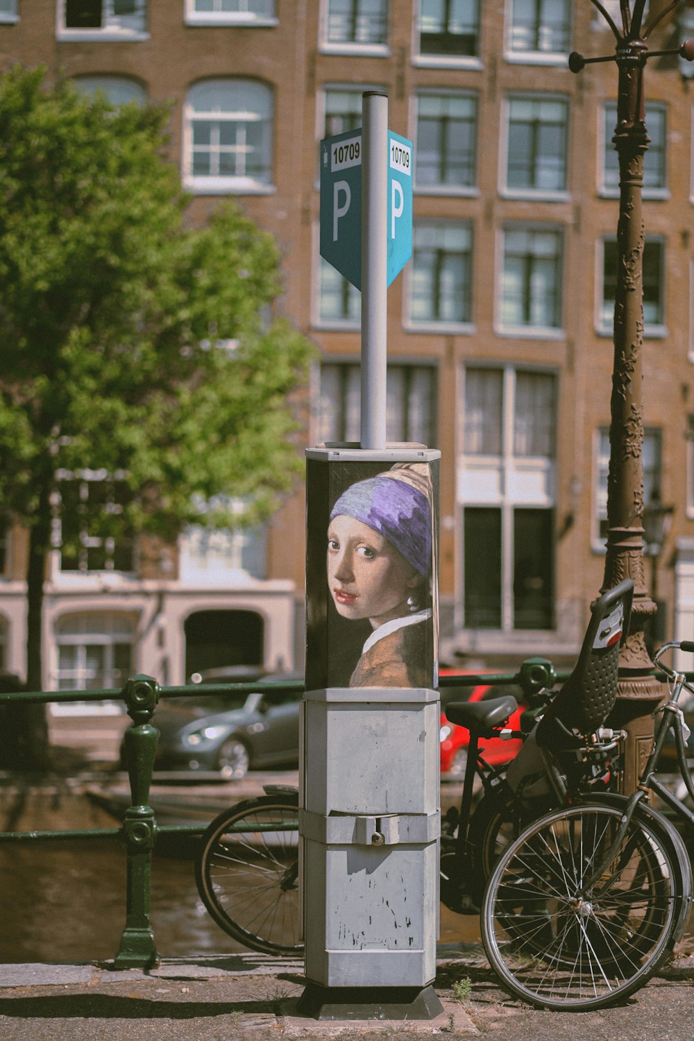 a person in a garment standing next to a bicycle