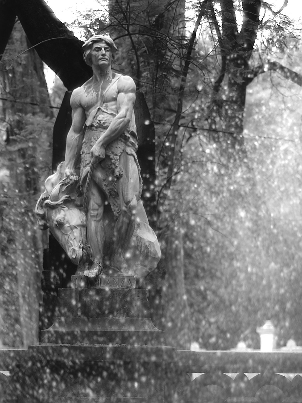 a statue of a man holding a torch