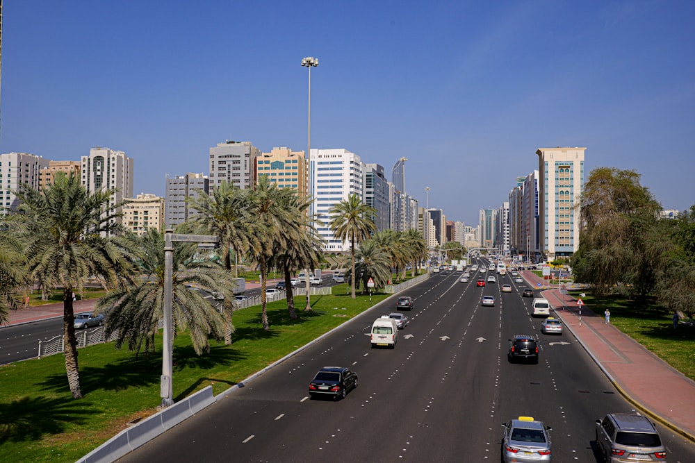 a highway with cars on it and buildings in the background