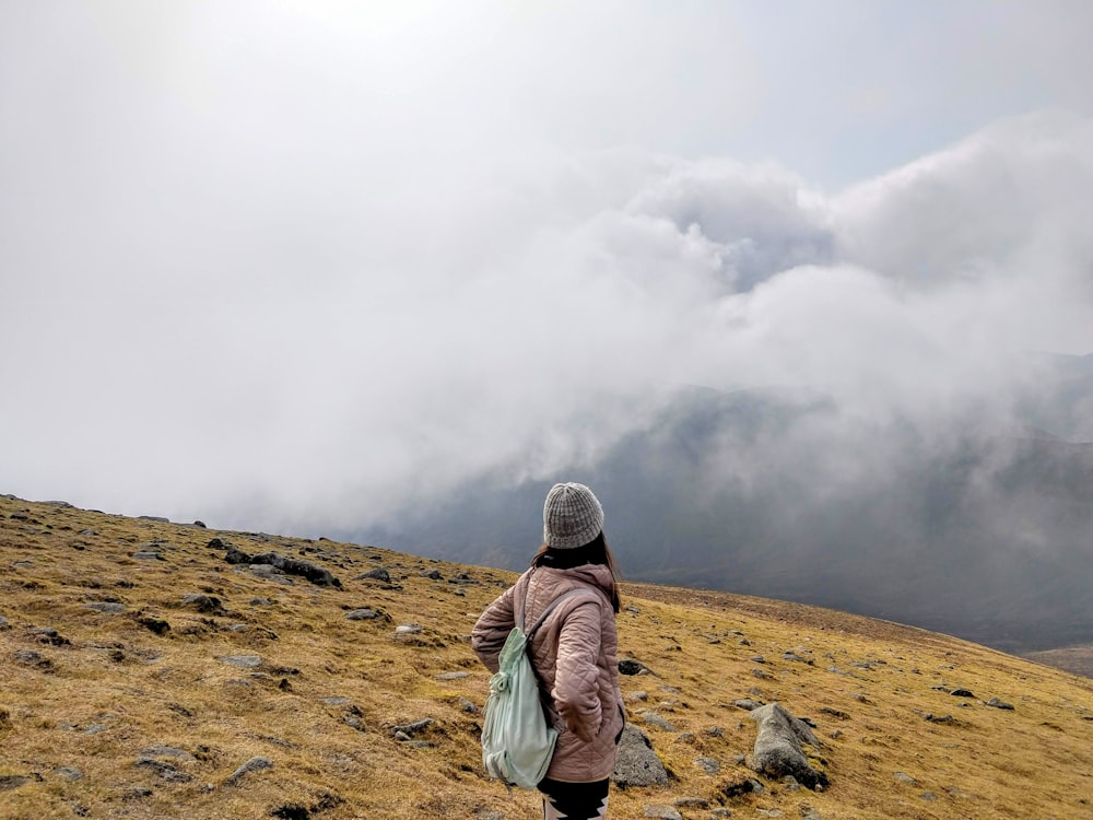 a man standing on a hill