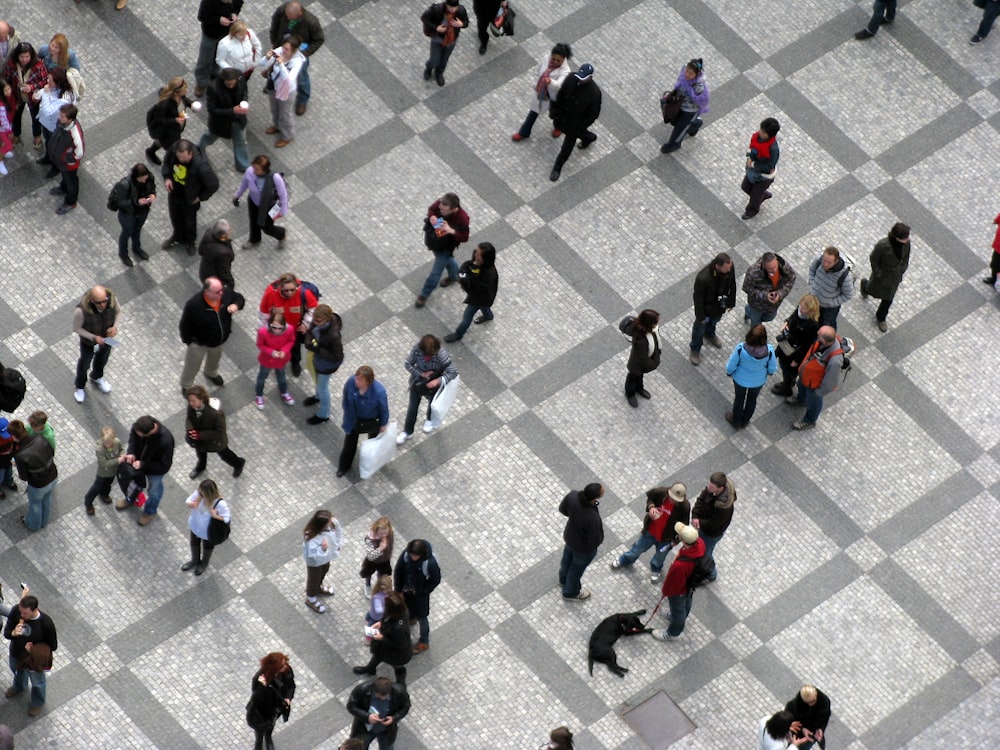 a group of people walking on a street