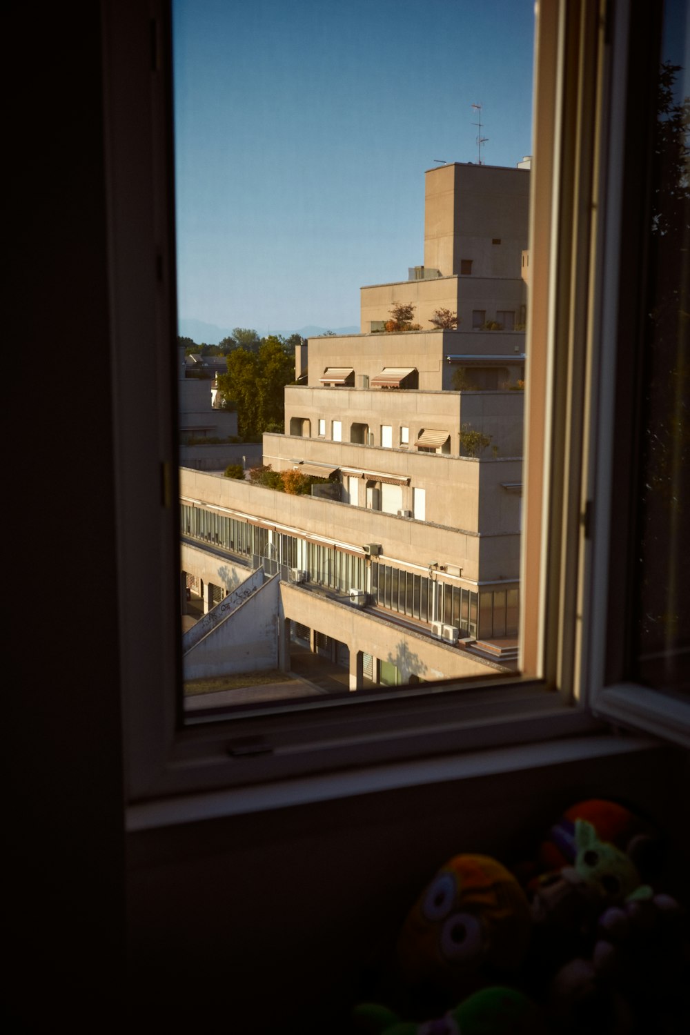 a window with a view of a street and buildings