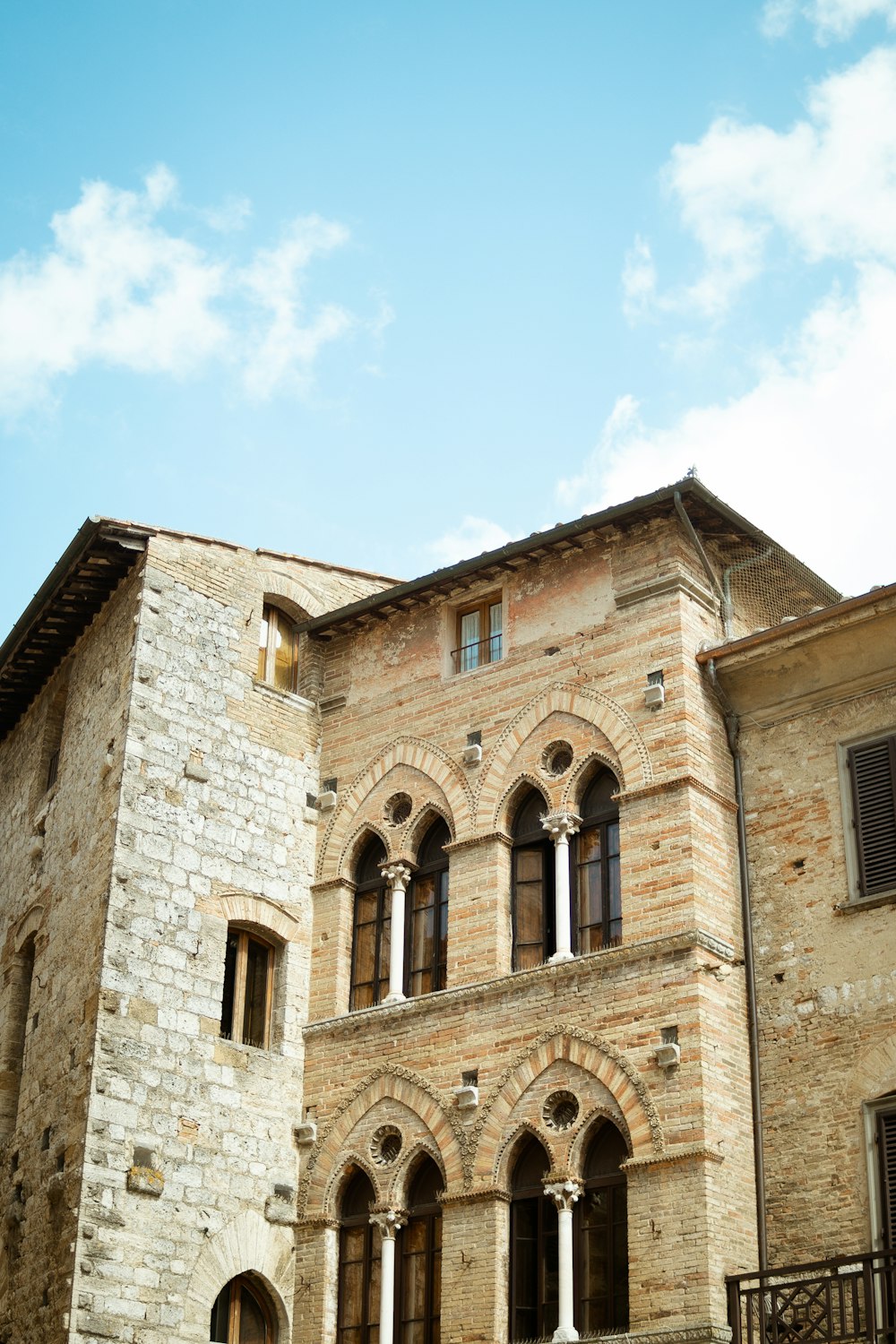 a stone building with a blue sky