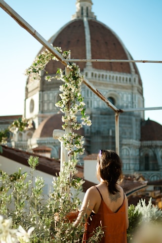 a person standing in front of a large building