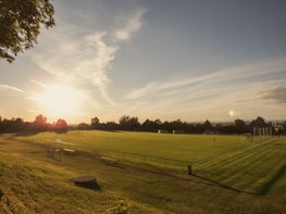 A panoramic view of the club’s training ground bathed in golden afternoon light.
