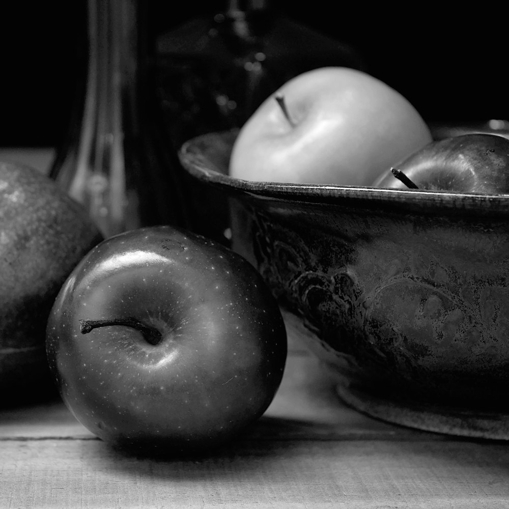 a group of apples sit on a table