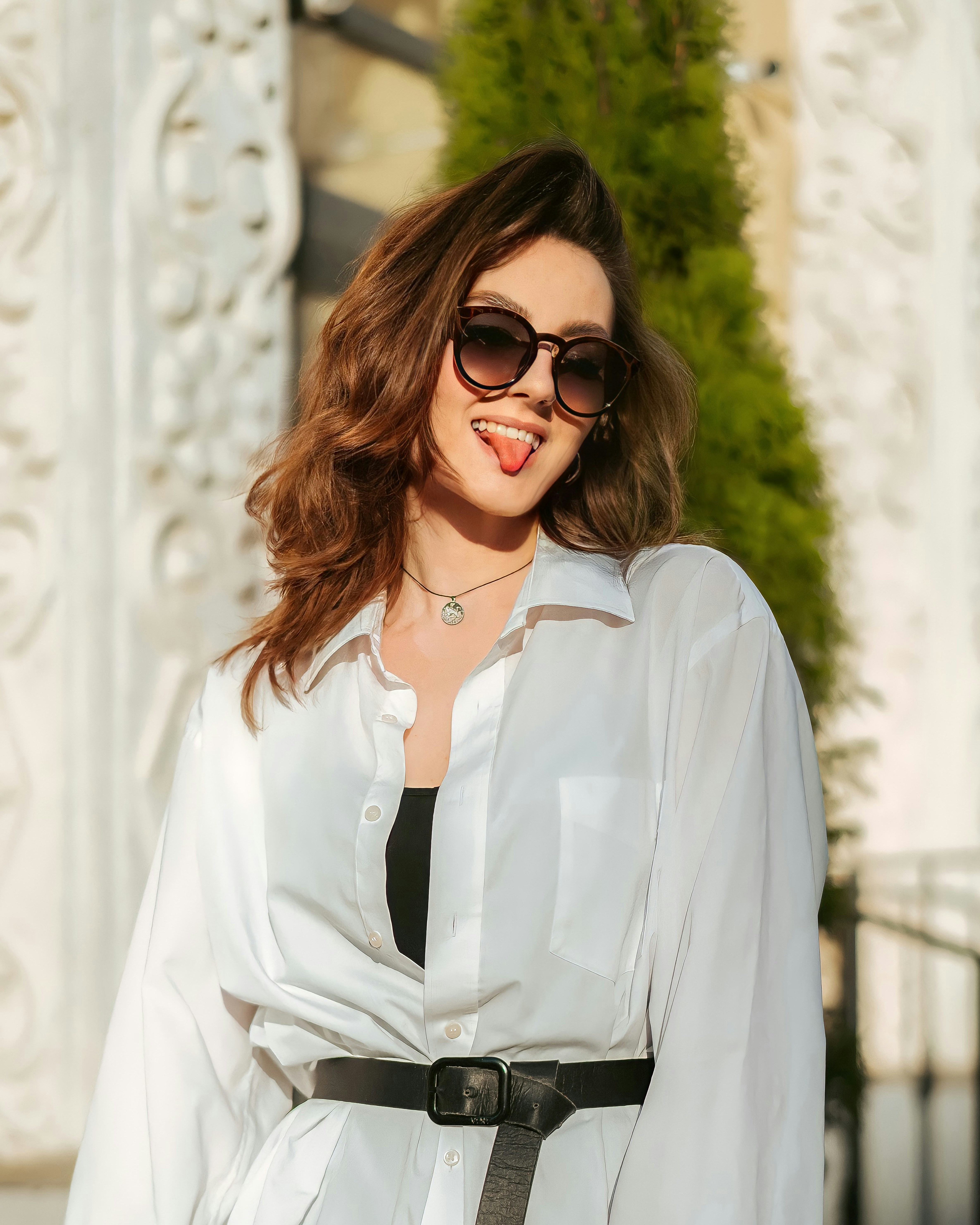 A woman wearing sunglasses photo – Free Portrait Image on Unsplash
