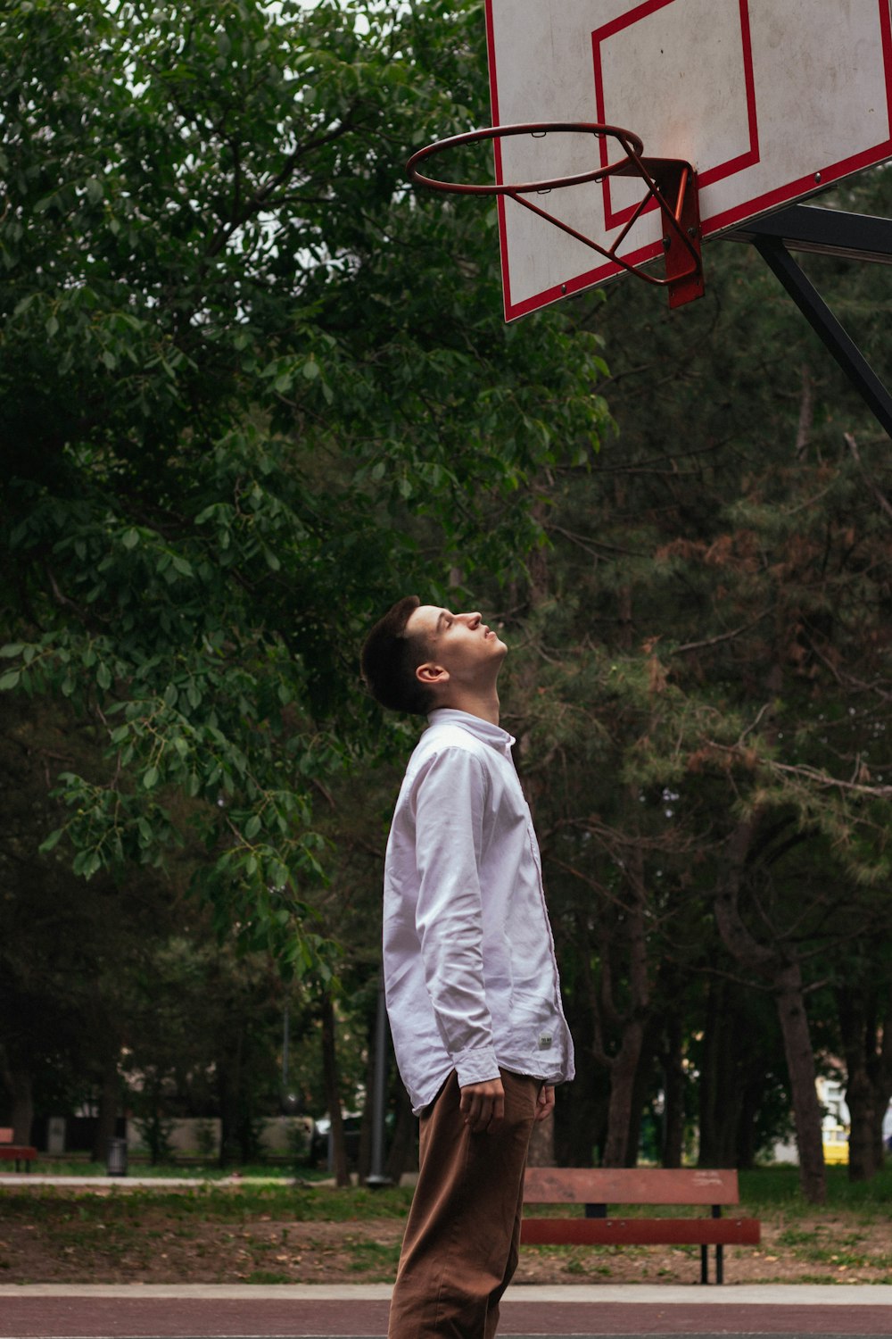 a person standing in front of a basketball hoop