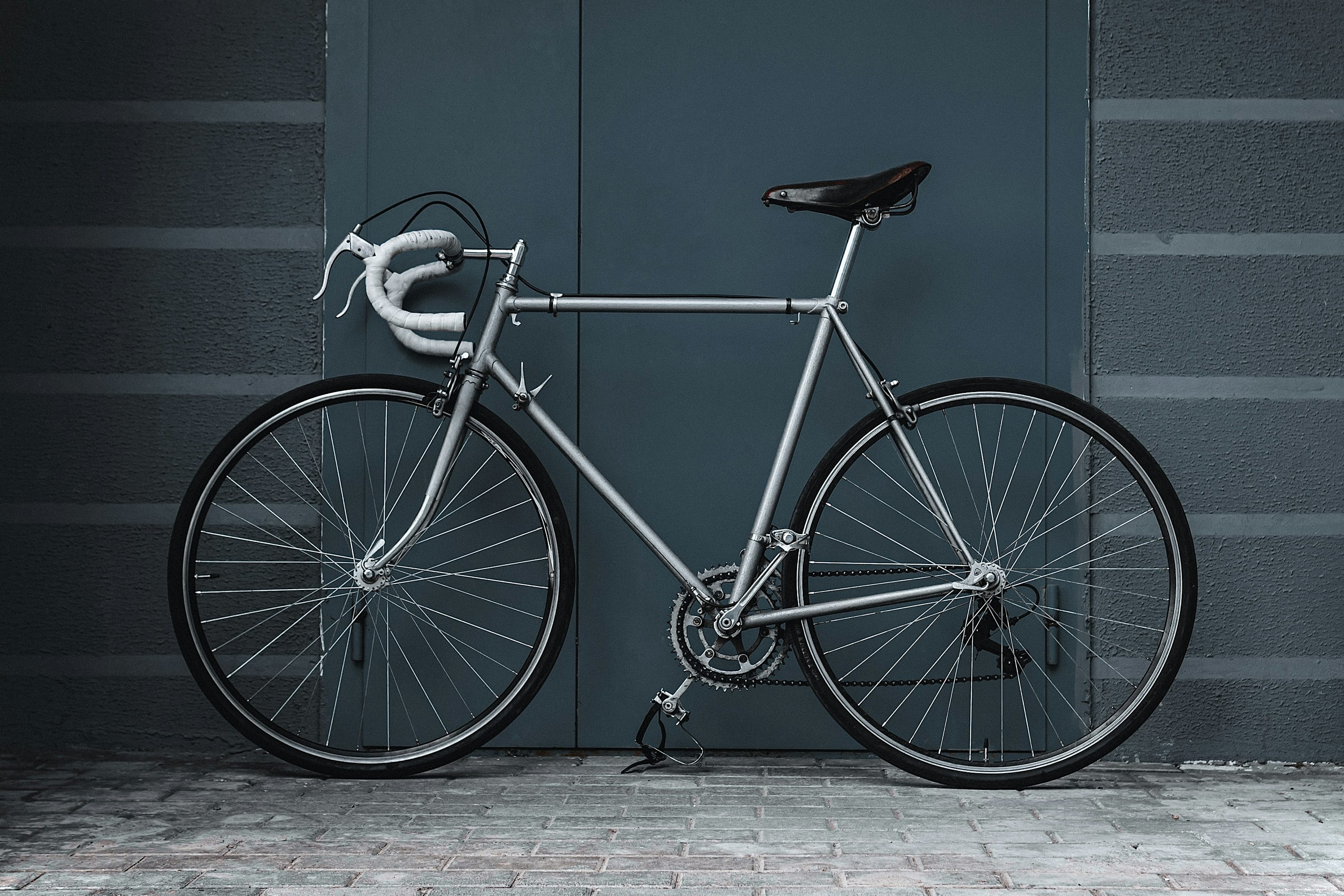 a bicycle parked in front of a door