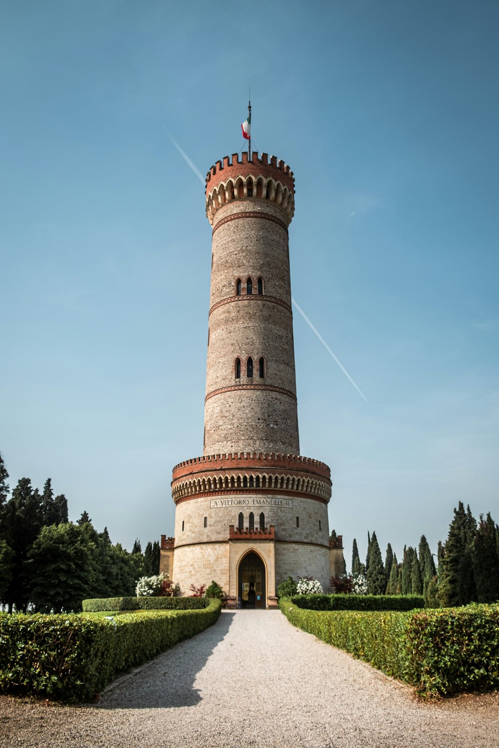 a tall tower with a flag on top