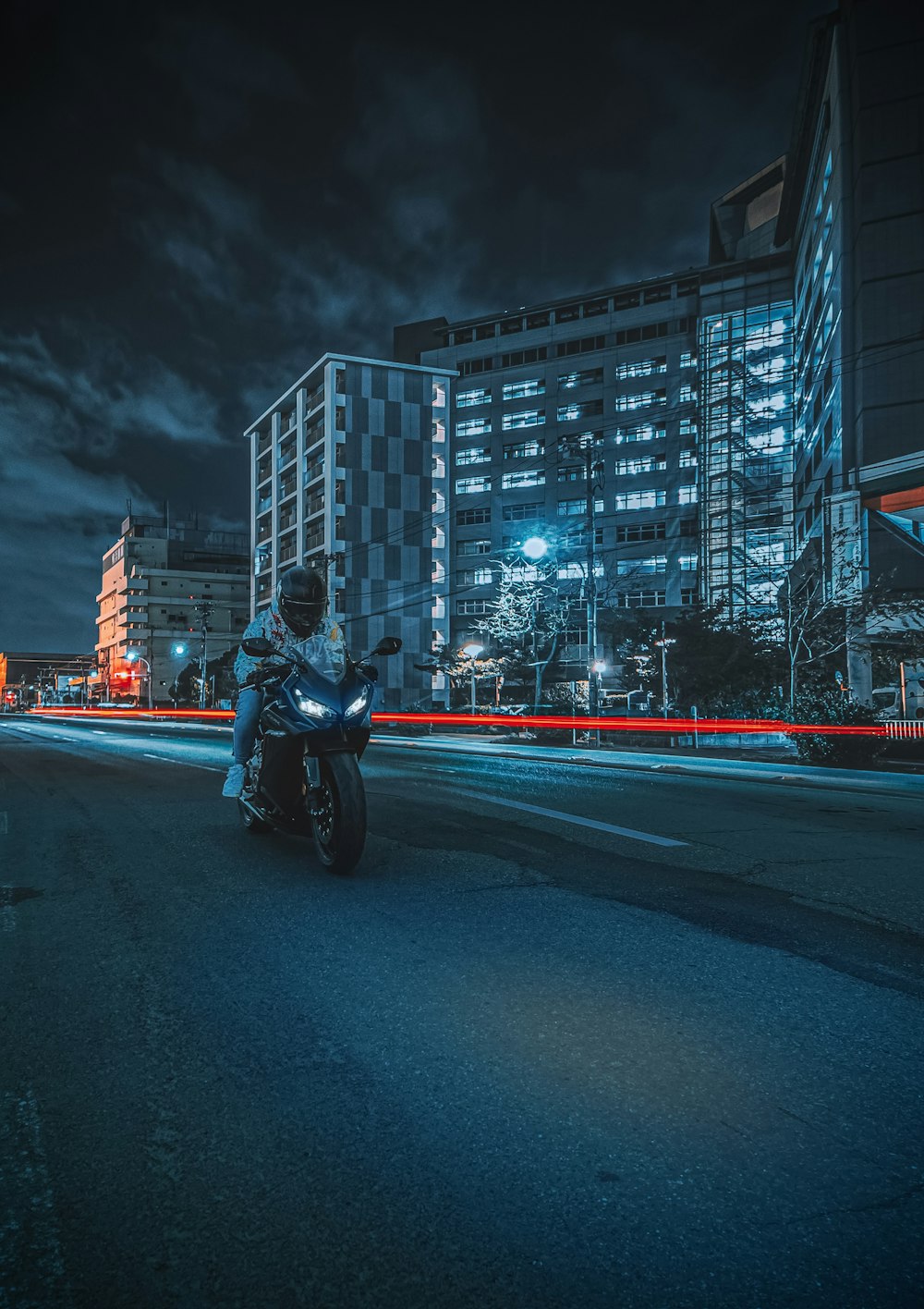 a person riding a motorcycle on a street