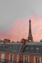 a tall tower behind a building
