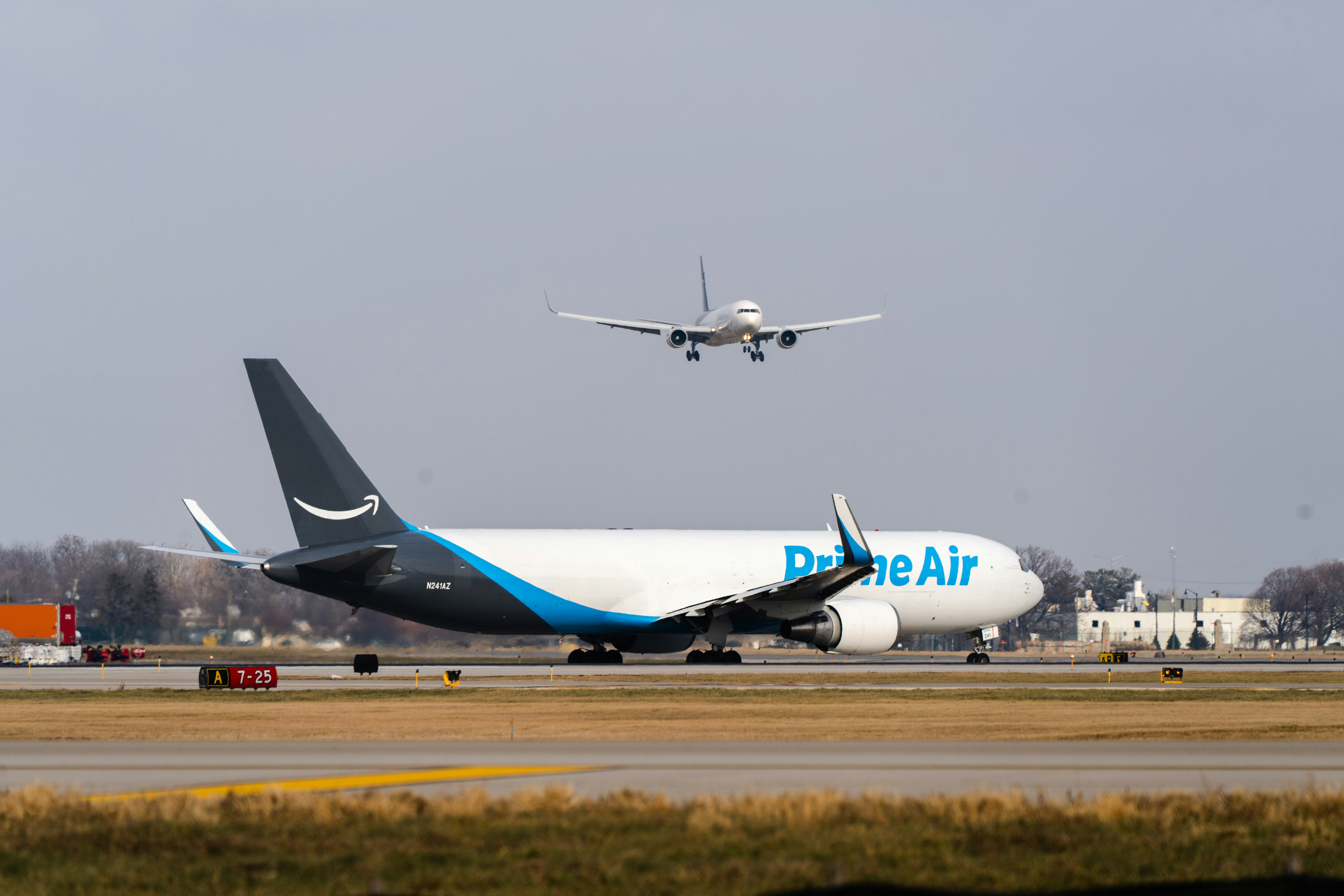 a couple of airplanes on a runway
