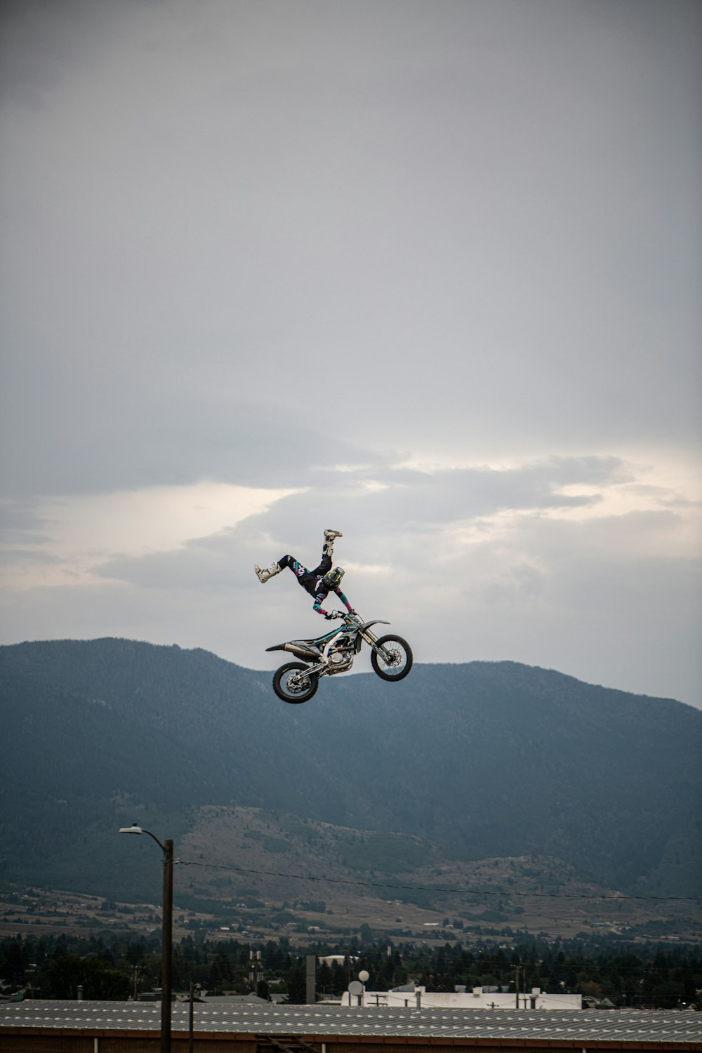 a person doing a trick on a motorcycle