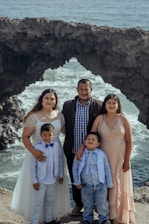Family photo of Amanda with her husband Adriano and their three children by the lake in Como, Italy.