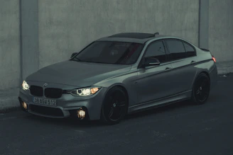 Elegant BMW sedan parked in an urban setting highlighting its signature kidney grille.