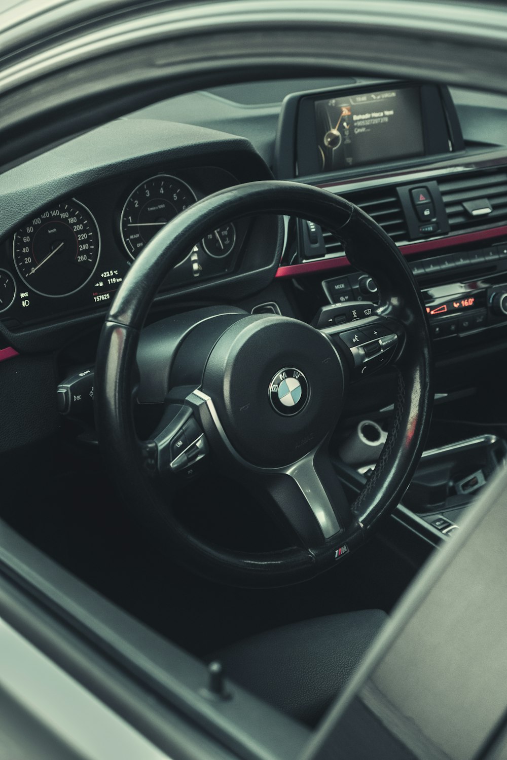 the steering wheel and dashboard of a car