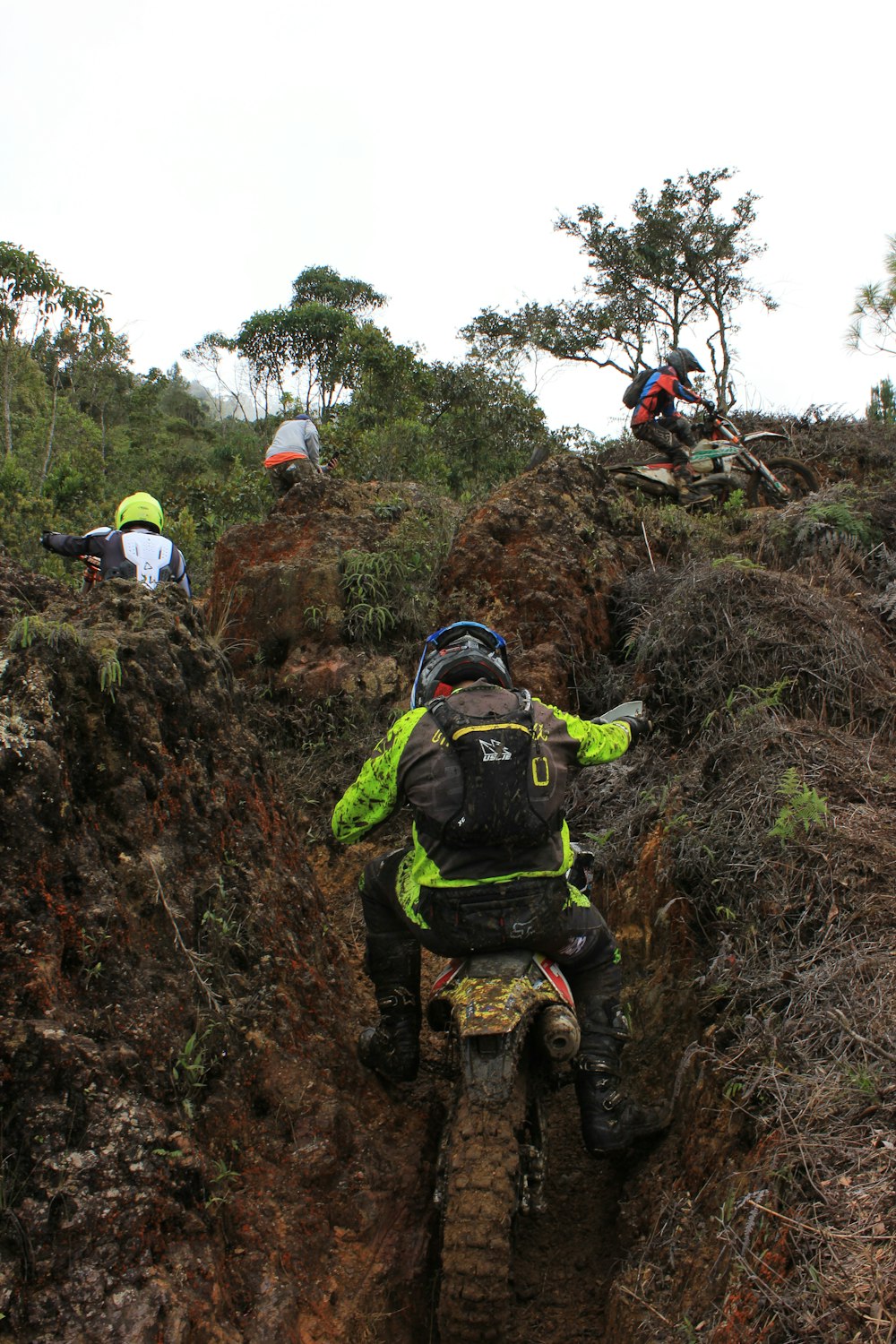 a group of people climbing a rock