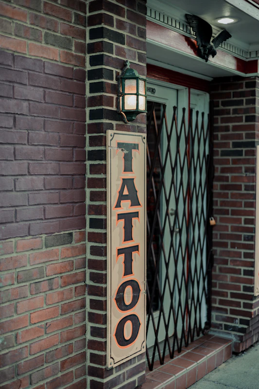 a sign on a brick wall