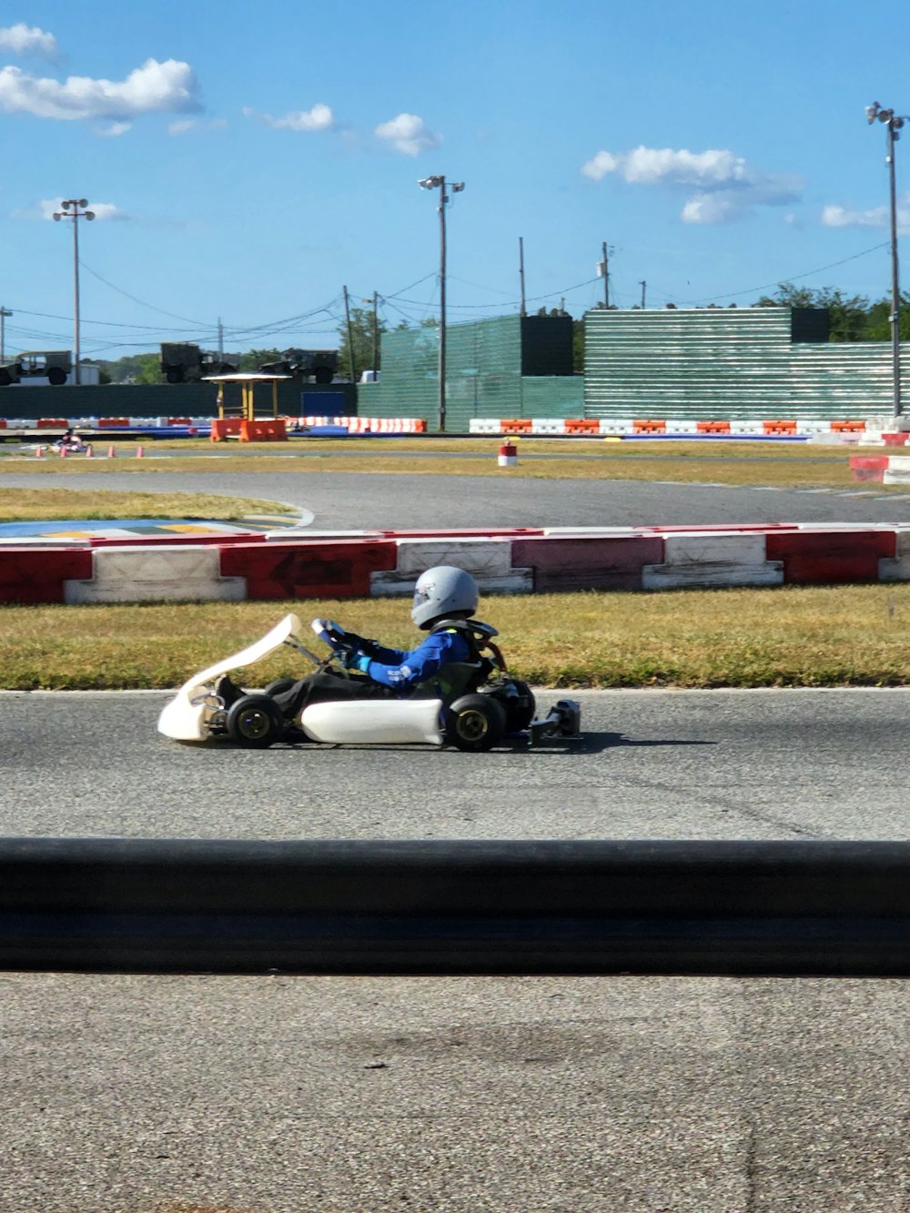 a person driving a go kart on a track